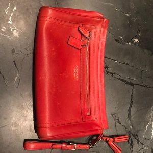 Orange Coach leather bag—large clutch